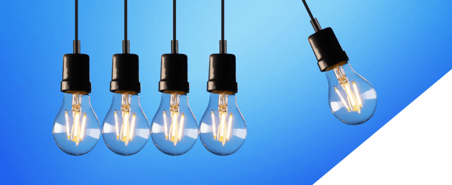 How outsourcing saves cost - article image of swinging lightbulbs
